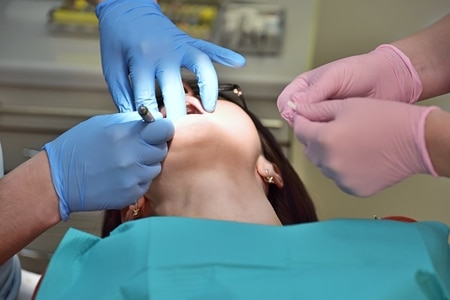 dentist conducting an operation in the mouth, close up