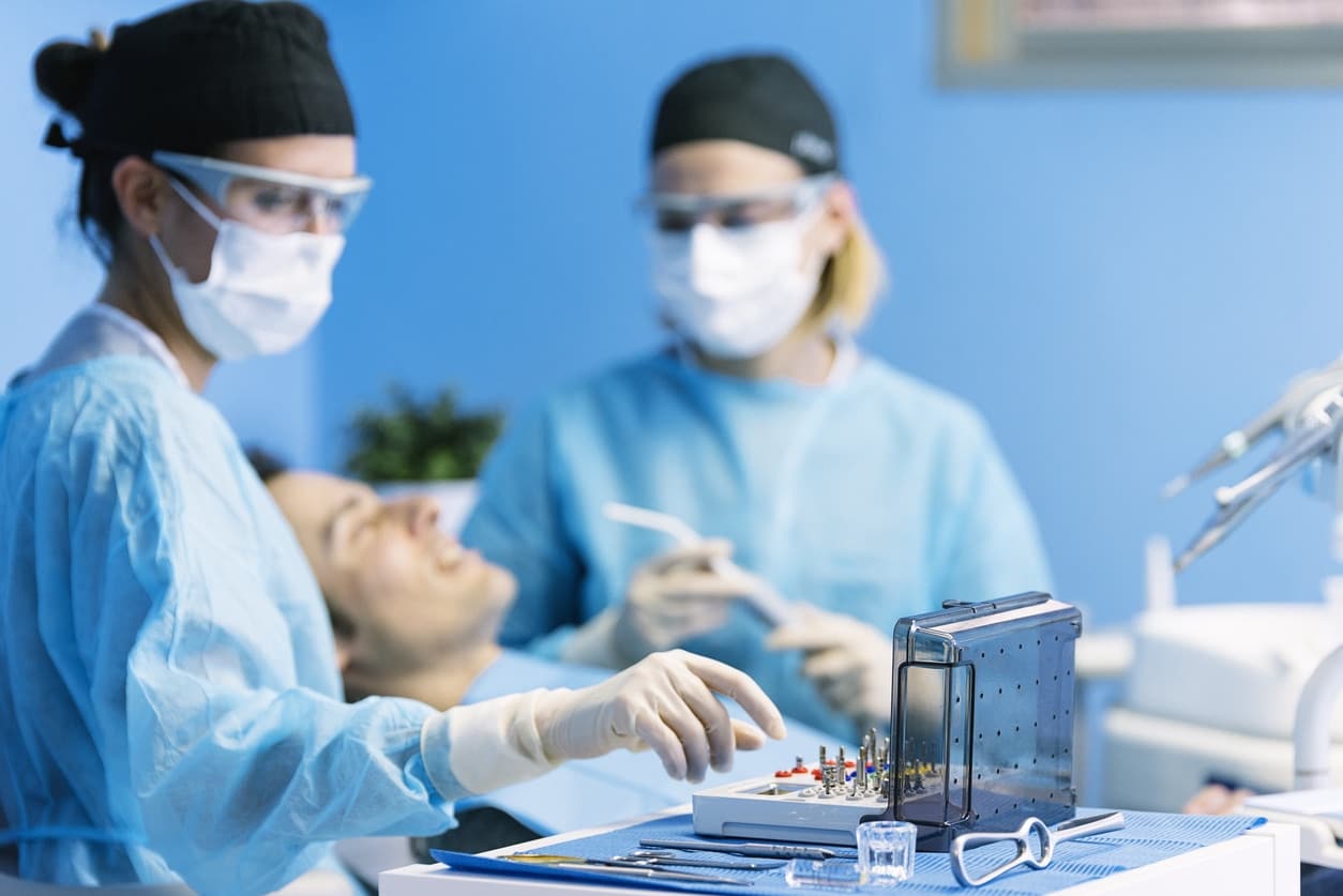 dentist with patient during procedure