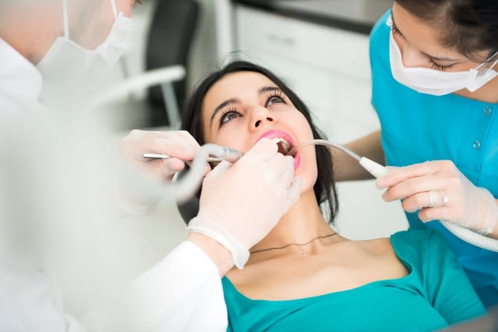 Dentists performing an operation